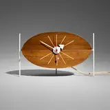 Watermelon table clock, model 2219D by George Nelson & Associates, 1954, walnut, enameled steel and metal, sold Jul 2026