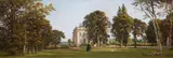 St. Gratien, An elegant lady and her dog walking in the gardens of a country house, pastel on paper laid down on canvas