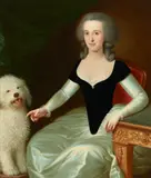 A portrait of a seated lady with a dog; A portrait of a gentleman by a desk holding a book (a pair) by English School 19th century, both oil on canvas, sold Nov 2018