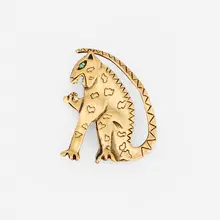 Joan Brown, Jaguar pin, 1986, 18k yellow gold vermeil sterling silver, emerald
