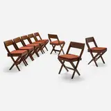 Chairs from the Central Library of Punjab University, Chandigarh, set of eight by Pierre Jeanneret, c. 1959, teak, cane, linen upholstery, sold Jun 2026