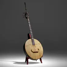 Carlo Bugatti, Mandolin, c. 1900, carved and ebonized wood, brass, pewter inlay, hand-decorated vellum, Italian walnut, bone, nylon strings
