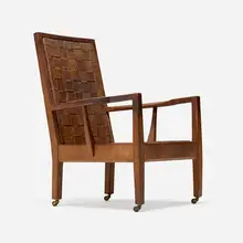 Gordon Russell, Lounge chair, walnut, leather, brass casters