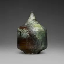 Cylindrical bottle form by Gertrud and Otto Natzler, 1968, earthenware with Cat's Eye Reduction Fired glaze with melt fissures, sold Jun 2026