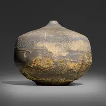 Closed form by Gertrud and Otto Natzler, 1971, earthenware with Ivory Celadon Reduction Fired glaze with melt fissures, flame marks, skinning, and iridescence, sold Jun 2026