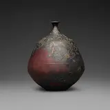 Gertrud and Otto Natzler, Bottle form with curved neck and lip, 1973, earthenware with Sang Reduction Fired glaze with flame marks, iridescence, and copper pools