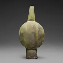 Flat long-necked bottle, oval form by Otto Natzler, 1980, earthenware with Applegreen Reduction Fired glaze with smoke traces and melt fissures, sold Jun 2026