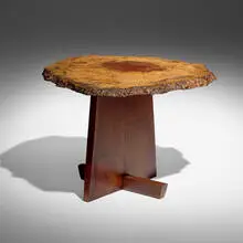 Minguren I end table by Mira Nakashima, 2000, American black walnut, English oak burl, sold May 2026