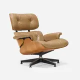 Charles and Ray Eames, 670 lounge chair, rosewood plywood, leather, brushed and enameled aluminum, rubber