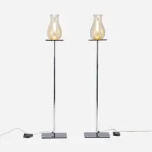 Philippe Starck, Floor lamps for the Clift Hotel, pair, c. 2001, chrome-plated steel, clear glass with aventurine bands