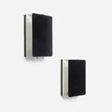 C1 wall sconces, pair by Charlotte Perriand, 1963, enameled steel, sold May 2026