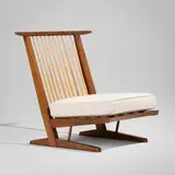 Conoid Cushion lounge chair by George Nakashima, 1972, American black walnut, hickory, upholstery, webbing, sold May 2026