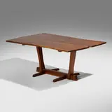 Special-order Conoid dining table by George Nakashima, 1971, American black walnut, East Indian laurel, sold May 2026