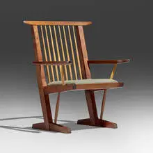 Conoid armchair by Mira Nakashima, 1998, American black walnut, hickory, upholstery, sold May 2026