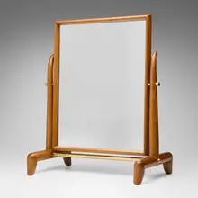 Vanity Mirror by T. H. Robsjohn-Gibbings, c. 1955, mahogany, mirrored glass, brass, sold May 2026