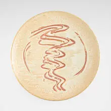 Monumental charger with finger swipes by Warren Mackenzie, 2007, shino-glazed stoneware, sold Apr 2026