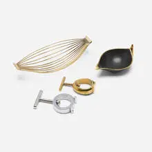 Collection of four tabletop accessories by Carl Auböck, brass, chrome-plated steel, patinated brass, sold May 2026