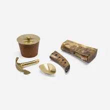 Carl Auböck, Collection of five tabletop accessories, 1940-1959, horn, brass, aluminum, leather