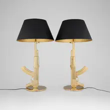 Philippe Starck, Gun table lamps, pair, 2005, gilt aluminum with polymer coating, gilt steel