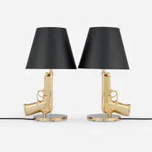 Philippe Starck, Golden Gun table lamps, pair, 2005, gilt aluminum with polymer coating, gilt steel