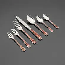 Christofle, Talisman flatware service, 1986, silverplate, sienna brown Chinese lacquer, stainless steel