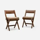 Chairs from the Central Library of Punjab University, Chandigarh, pair by Pierre Jeanneret, c. 1959, teak, cane, linen, sold May 2026