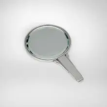 Hand mirror, model 224 by Harald Nielsen, c. 1930, sterling silver, glass mirror, ebony, sold May 2026