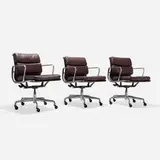Charles and Ray Eames, Soft Pad Management chairs, set of three, 1969 / 2000, polished aluminum, leather upholstery, lacquered steel