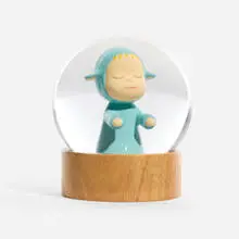 Little Wanderer Snow Globe (Blue) by Yoshitomo Nara, 2023, glass, wood, sold Oct 2025