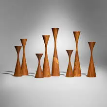 Rude Osolnik, Collection of eight candlesticks, c. 1991, kingwood, walnut