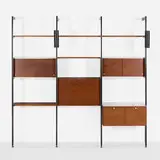 CSS (Comprehensive Storage System) by George Nelson & Associates, 1959, walnut veneer, enameled and brushed aluminum, laminate, lacquered Masonite and wood, sold Apr 2026