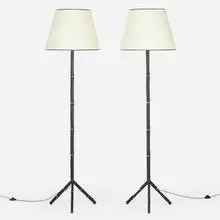 Jacques Adnet, Floor lamps, pair, c. 1950, saddle-stitched leather over steel, vellum, brass
