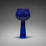 Round chalice on conical base by Gertrud and Otto Natzler, 1962, earthenware with Mystic Blue glaze, sold Jan 2026