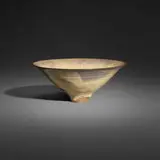 Bowl by Gertrud and Otto Natzler, 1966, earthenware with Ivory Celadon Reduction Fired glaze with melt fissures and smoke traces, sold Jan 2026