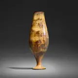 Footed vase form with lip by Gertrud and Otto Natzler, 1968, earthenware with Tiger Eye Reduction Fired glaze with melt fissures, sold Jan 2026