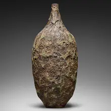 Tall bottle form by Gertrud and Otto Natzler, 1974, earthenware with Verdigris Crater glaze, sold Jan 2026