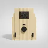 Air King radio, model 52 with Egyptian insert by Harold Van Doren and John G. Rideout, 1933, Bakelite, enameled brass, fabric, sold Apr 2026