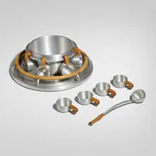 Russel Wright, Punch bowl set, c. 1935, spun aluminum, bamboo, cherry