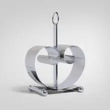 Norman Bel Geddes, Magazine rack, c. 1935, chrome-plated brass