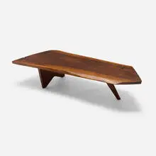 Slab coffee table by George Nakashima, 1956, American black walnut, rosewood, sold Jan 2026