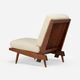 Cushion chair by George Nakashima, c. 1958, American black walnut, upholstery, sold Jan 2026