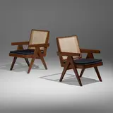 Lounge chairs from the Punjab Engineering College, Chandigarh, pair by Pierre Jeanneret, c. 1955, teak, cane, upholstery, sold Jan 2026