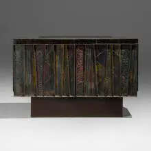 Paul Evans, Deep Relief cabinet, c. 1975, torch-cut, welded, polychromed and patinated steel, cleft slate, lacquered wood