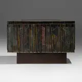 Paul Evans, Deep Relief cabinet, c. 1975, torch-cut, welded, polychromed and patinated steel, cleft slate, lacquered wood