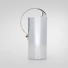 Norman Bel Geddes, Pitcher, c. 1935, chrome-plated metal, brass