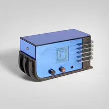 Sparton radio, model 557 by Walter Dorwin Teague, c. 1936, midnight blue Tuf-Flex mirrored glass, chrome-plated steel, lacquered wood, Bakelite, sold Apr 2026