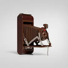 Walter Dorwin Teague, Kodak camera, model 1A, c. 1930, enamel on metal, paper, lacquered wood