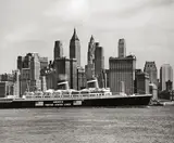 Andreas Feininger, S.S. America and the skyscrapers of Downtown Manhattan, New York City