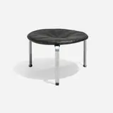PK 33 stool by Poul Kjærholm, 1959, leather upholstery, matte chrome-plated steel, lacquered wood, plastic, sold Apr 2026