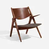 Sawbuck chair by Hans J. Wegner, 1951, stained oak, upholstery, sold Apr 2026